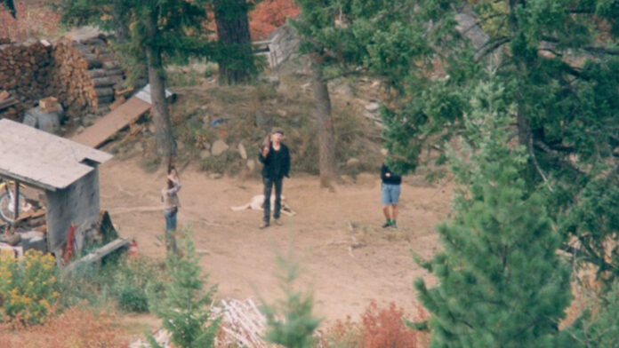 Randy Weaver in front of his house at Ruby Ridge